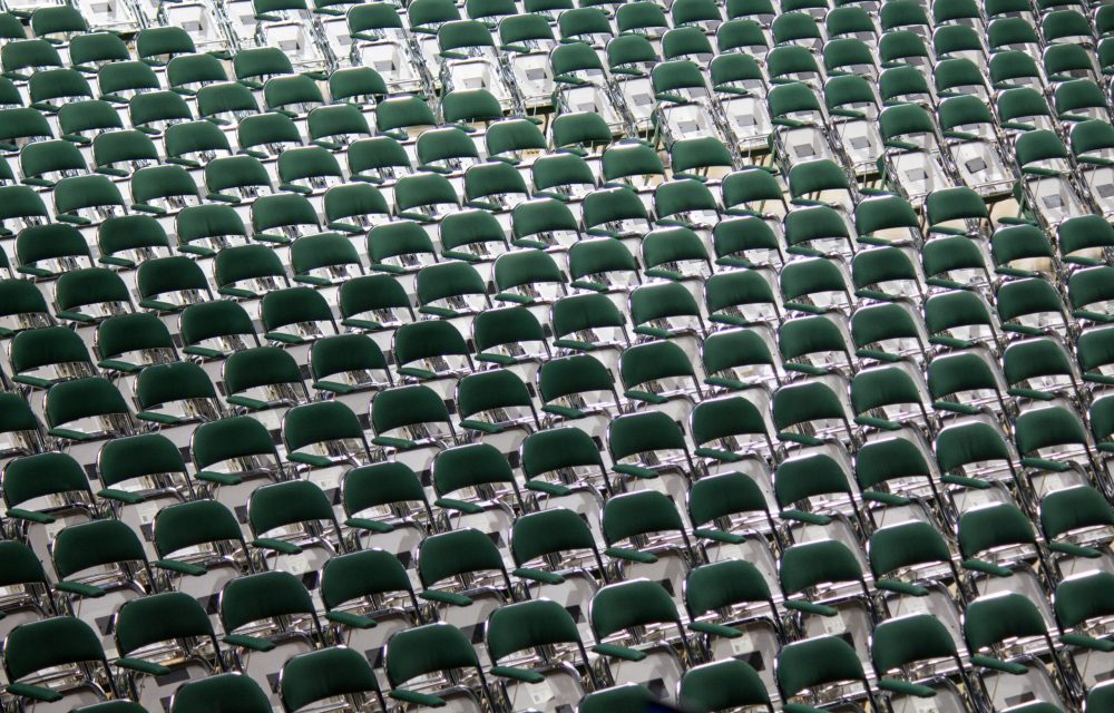 A wide shot of multiple chairs arranged in a row